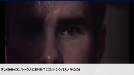 close-up of male adult with sweat on his brow and a anxious expression  with the closed caption "Flashback: Announcement coming over a radio"